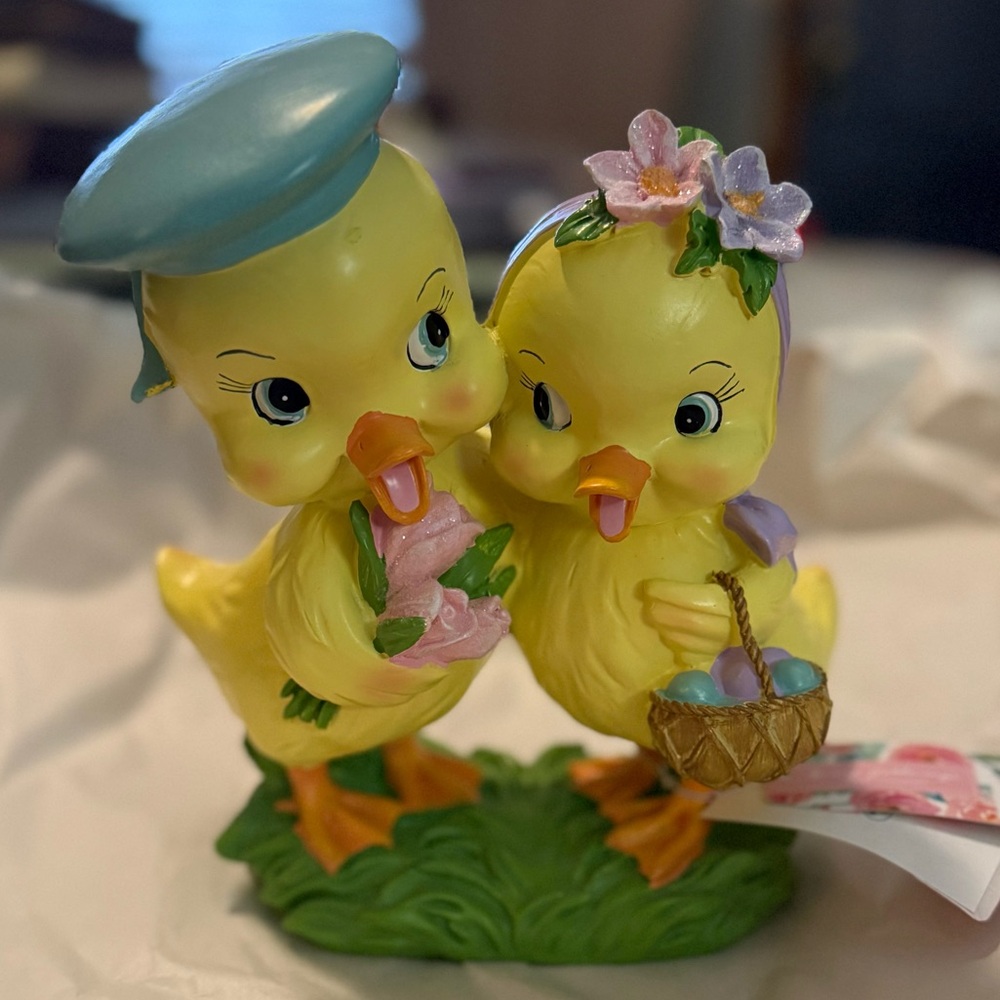 Charming Yellow Duck Figurine with Blue Hat and Pink Flowers
